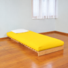 Devon timber sofa bed with yellow futon mattress