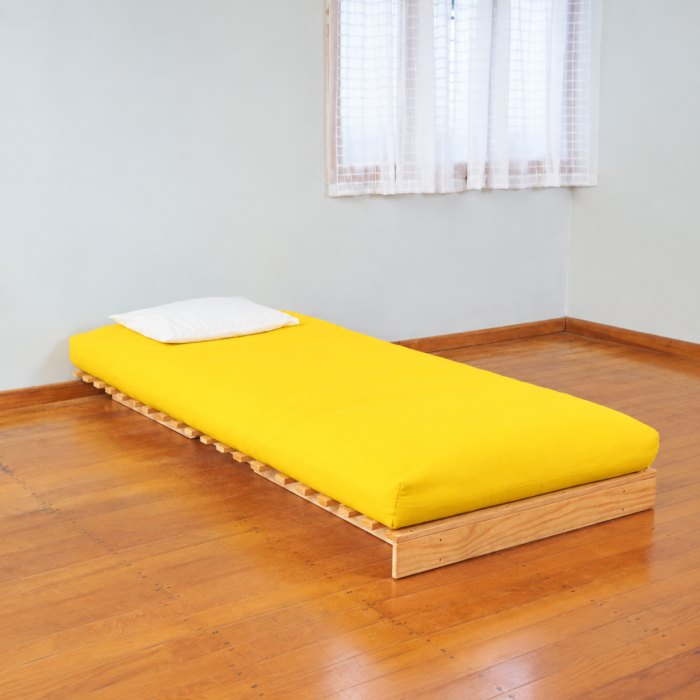 Devon timber sofa bed with yellow futon mattress